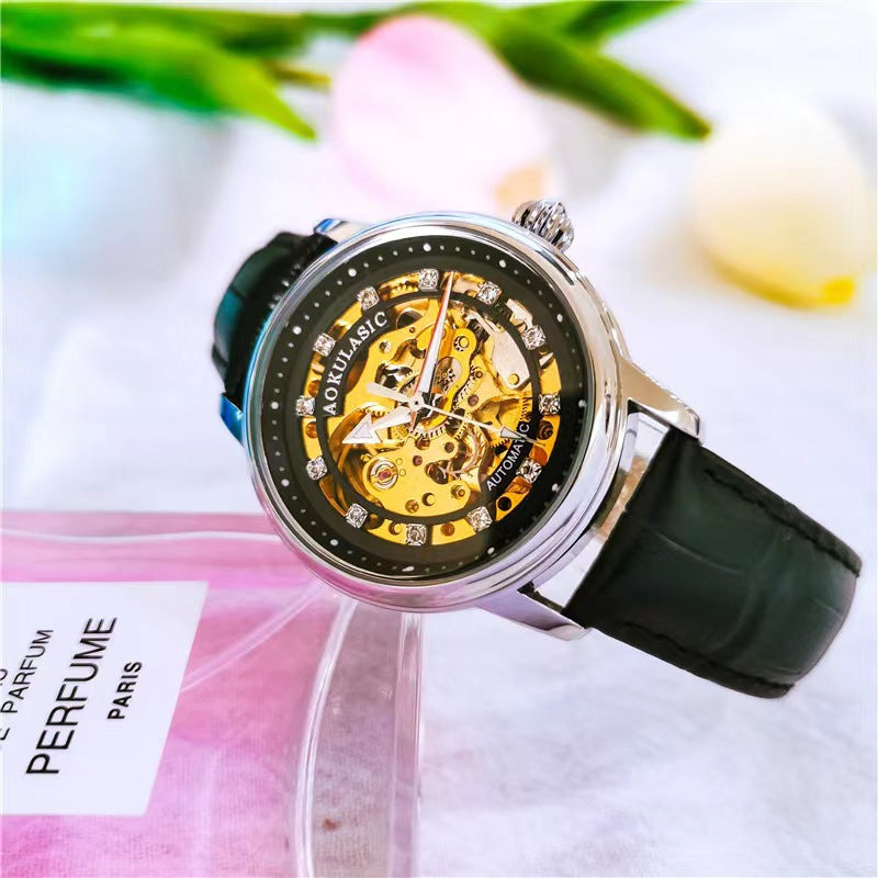Black leather mechanical watch with silver-tone case and diamond-accent bezel