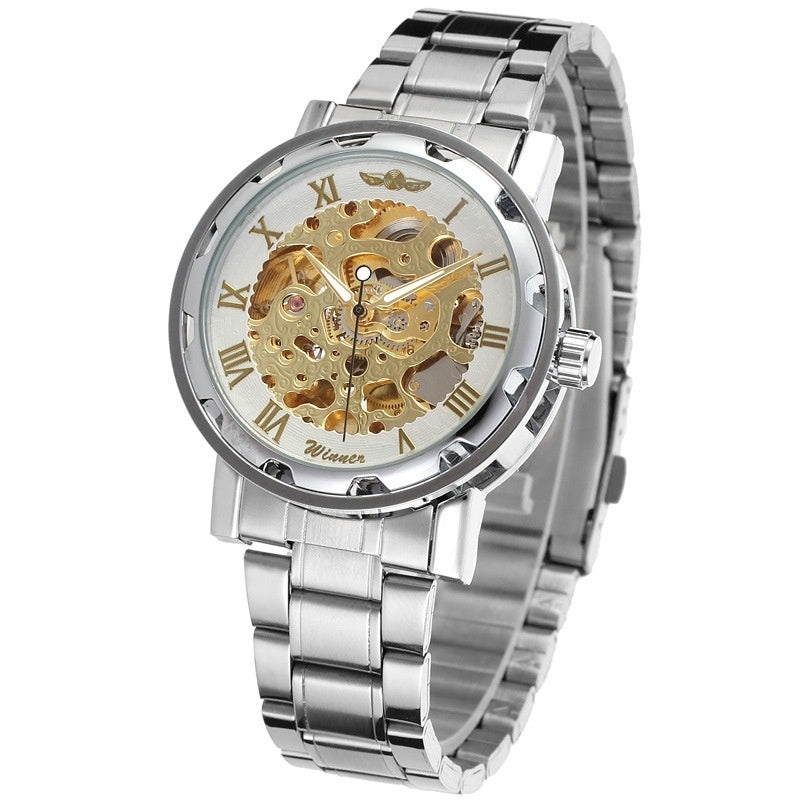 Mechanical skeleton watch with gold-toned gears on a silver dial, Roman numerals