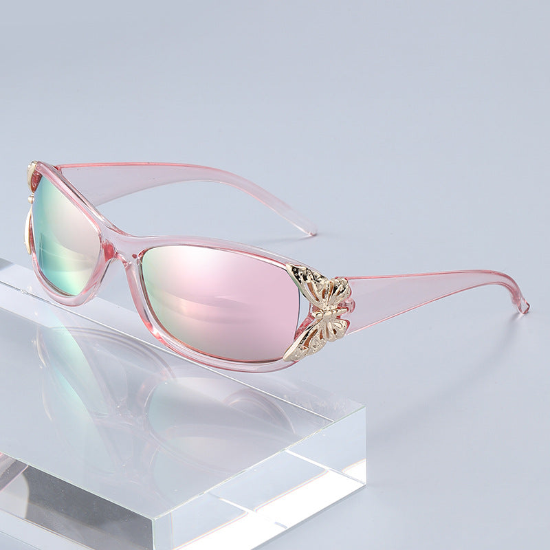 Clear pink driving sunglasses with soft pink lenses and gold-tone floral bridge detail