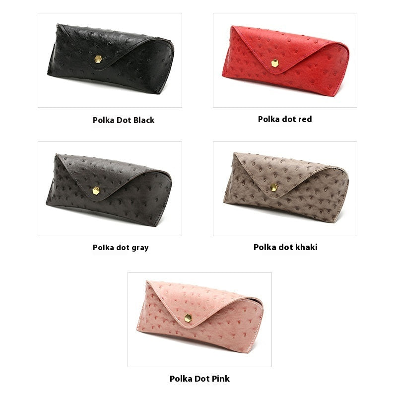 Assorted polka dot leather sunglasses cases in black, red, gray, and khaki with gold clasps