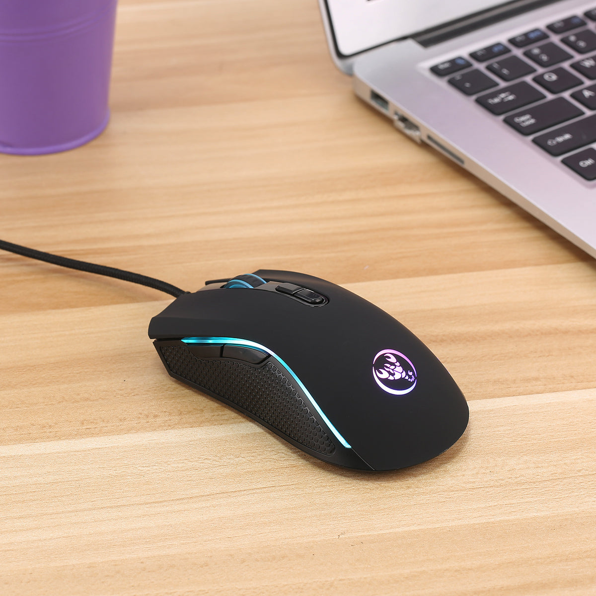 Black wired gaming mouse with RGB accent stripe and textured grip