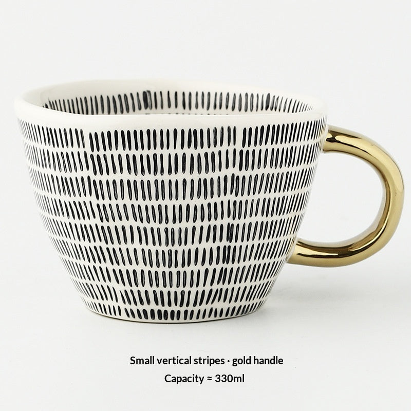 Ceramic mug with small vertical stripe pattern and gold handle