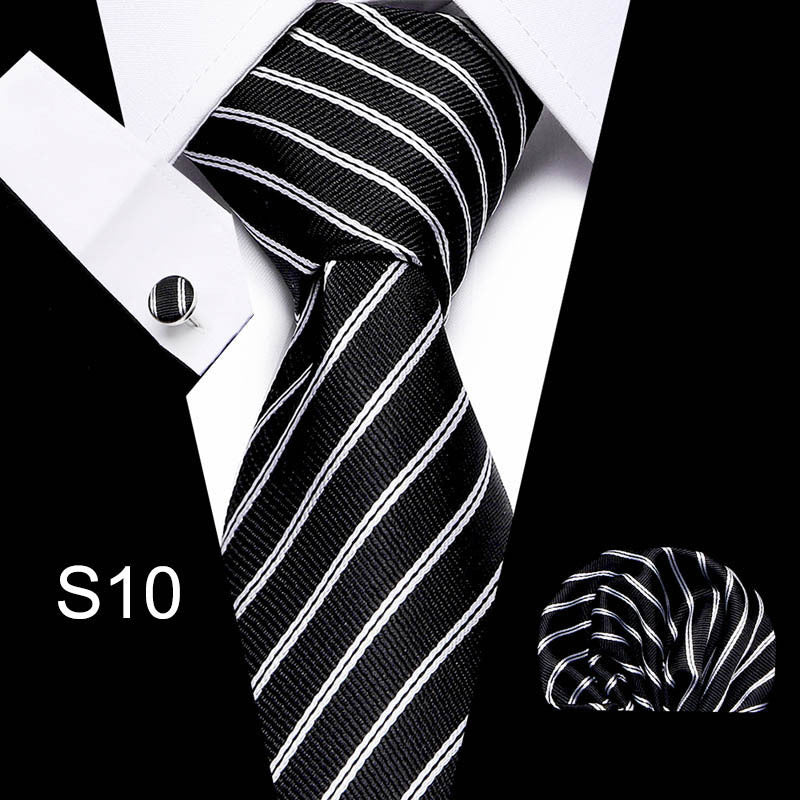 Business tie in black with white diagonal striping and matching pocket square.