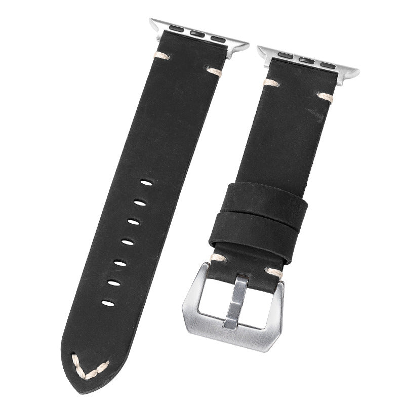 Black leather watch straps with embossed shield detail, silver buckles, and punched hole rows