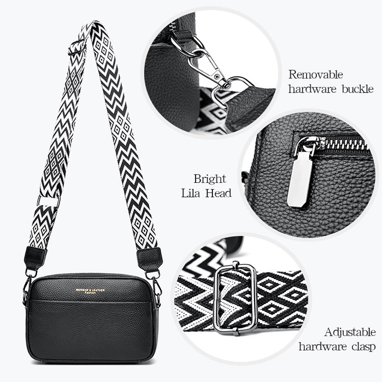 Black crossbody bag with removable hardware buckle and adjustable strap clasp details