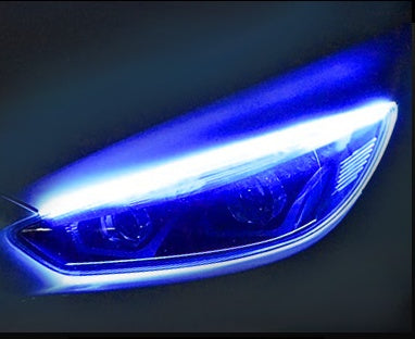 Car LED daytime running light strip close-up with vivid blue LED glow