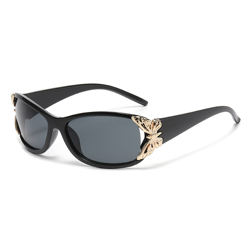Black driving sunglasses with dark lenses and gold-tone deer-style emblem on the bridge