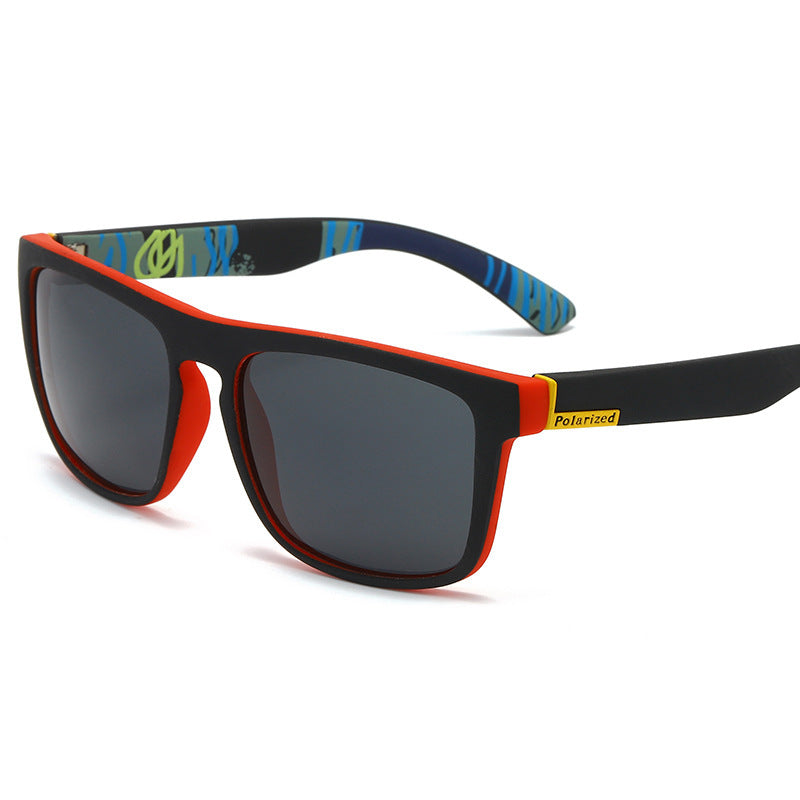 Polarized sports sunglasses with red-trim blue patterned frame and dark square lenses