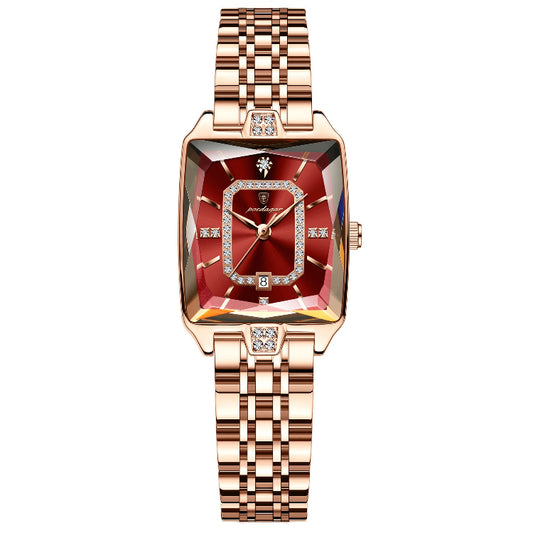 Luxury watch with rose gold strap and red face on a white background