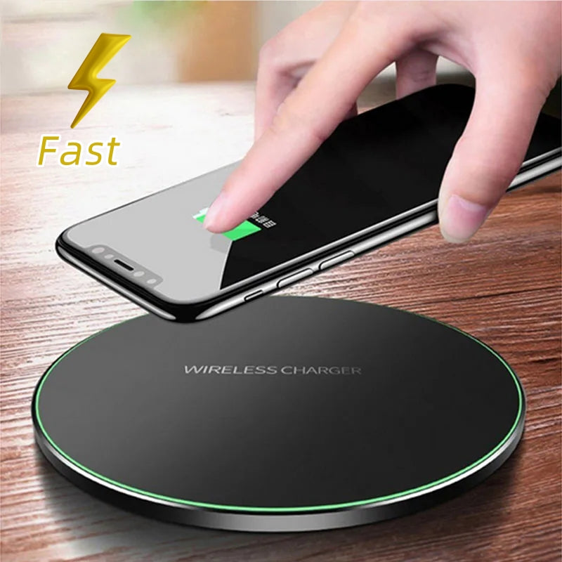 Black wireless charging pad with green LED ring and phone charging indicator on top