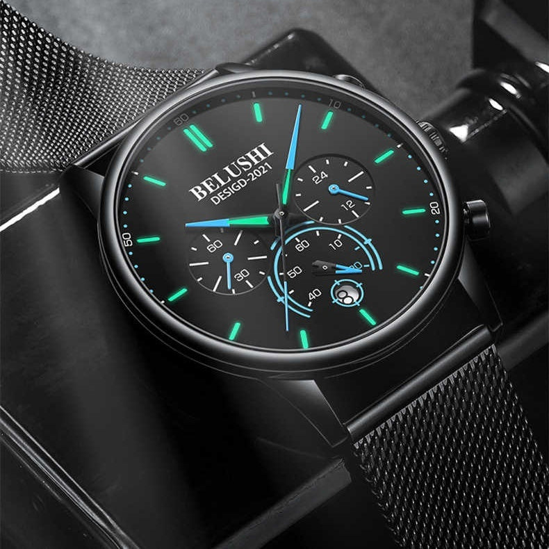Men's black quartz wristwatch with green accent dial and black mesh strap.