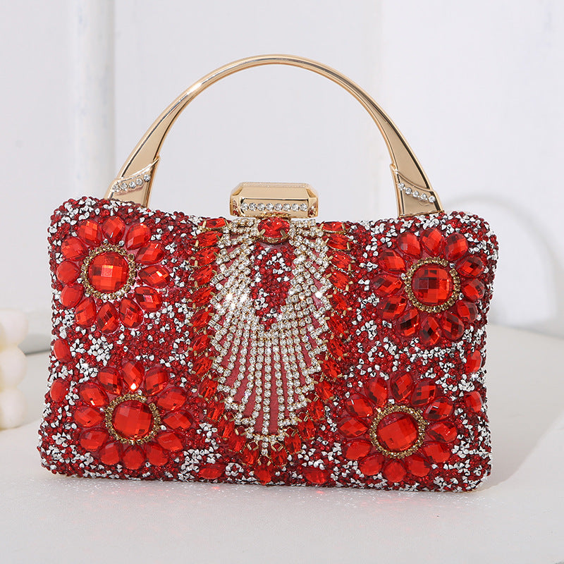 Handmade diamond clutch bag in red with crystal floral design, gold-tone handle