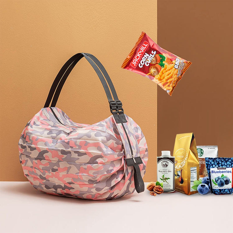 Large camo nylon reusable tote with black webbing handles, folded circular body.