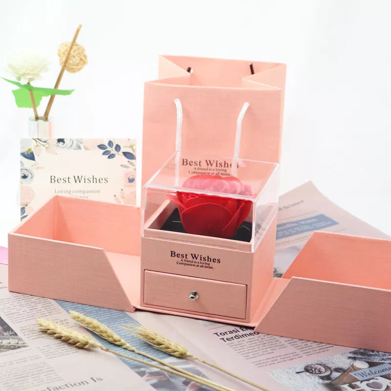 Pink rose jewelry gift box with clear rose compartment, side trays, and a front drawer