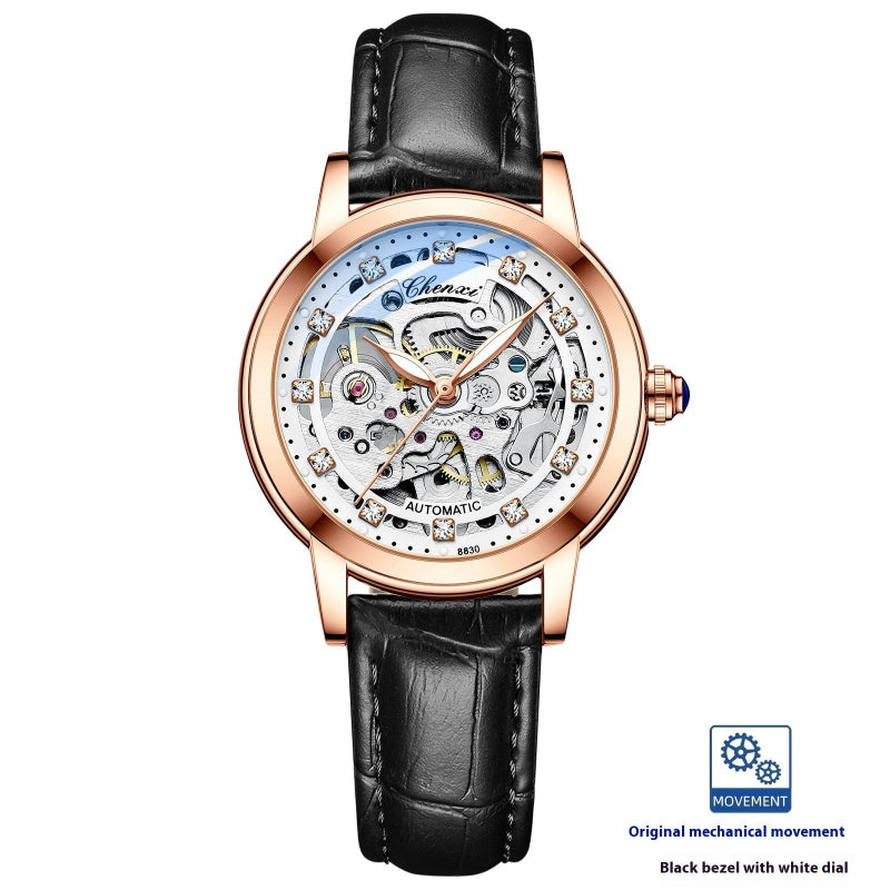 Rose gold skeleton mechanical watch with black leather strap, black bezel, open dial
