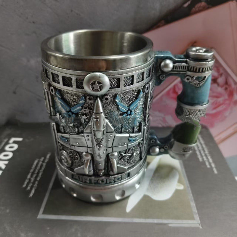 Silver metal-look mug with dark blue aircraft scenes and eagle emblem