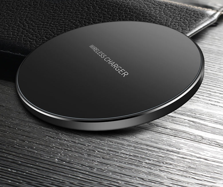 Black round wireless charging pad with 'Wireless Charger' text and silver rim