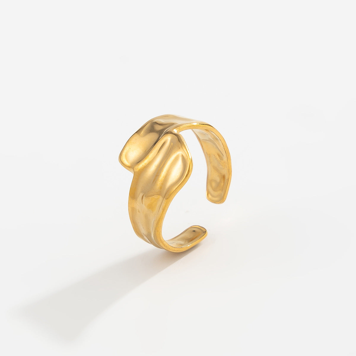 Gold 18K vacuum-plated curved open ring with smooth sculpted edges