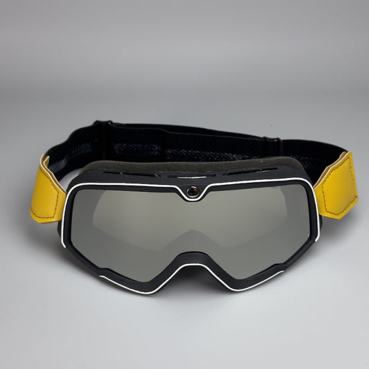 Black and yellow goggles with a gray background