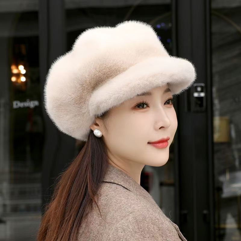 Cream faux fur hat with rounded crown and wide band; side view