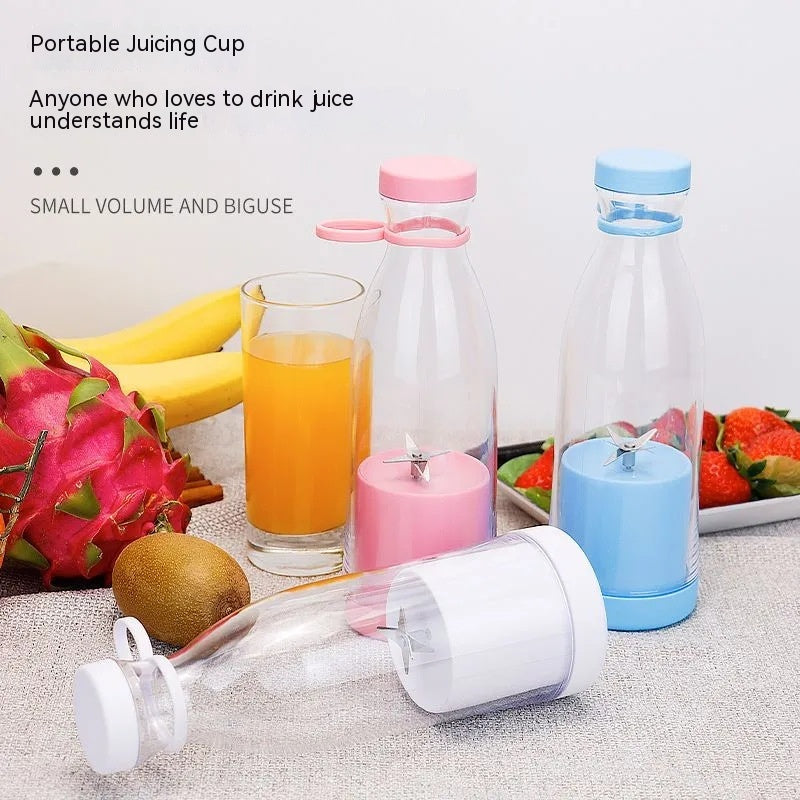 Portable mini juice blender cups in pink, blue, and clear with removable lids and blade stems