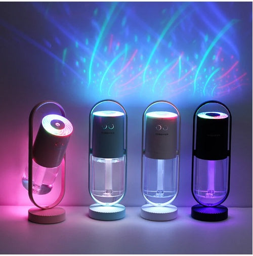 Four USB humidifiers standing with colorful mist effects and glowing LED lights