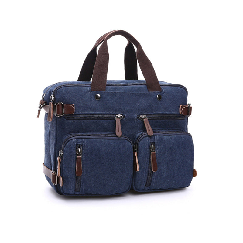 Navy-blue canvas bag with top handles, multiple front pockets, and adjustable shoulder strap