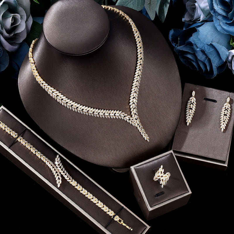 Gold-toned zircon necklace set with matching earrings and bracelet, in gift boxes