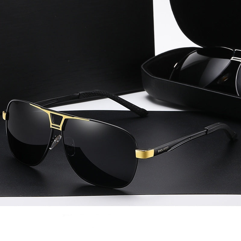 Polarized sunglasses with black lenses and gold trim on the frame
