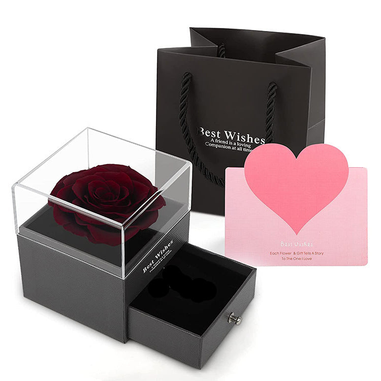 Acrylic jewelry gift box with dark red rose centerpiece and pink heart card, open