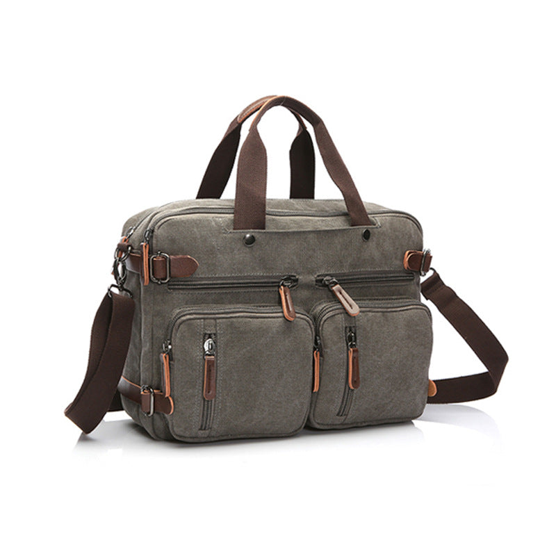 Gray canvas bag with top handles and two front zip compartments with adjustable strap
