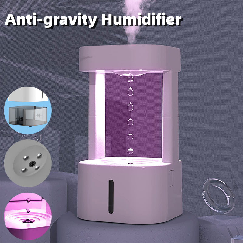 White anti-gravity water drop humidifier with purple light and rising mist droplets