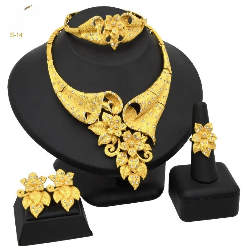 Gold-plated floral necklace set with coordinating earrings and ring