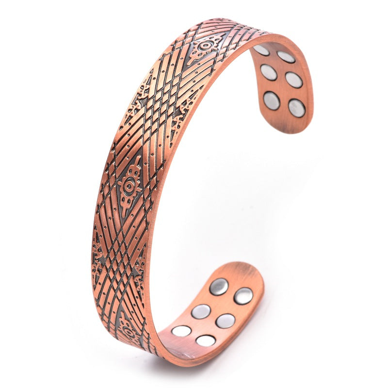 Copper magnetic therapy bracelet with textured lattice pattern and oval magnet inlay plates.