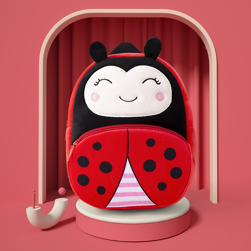Plush kids backpack with ladybug face design, black dots on red body and zipper