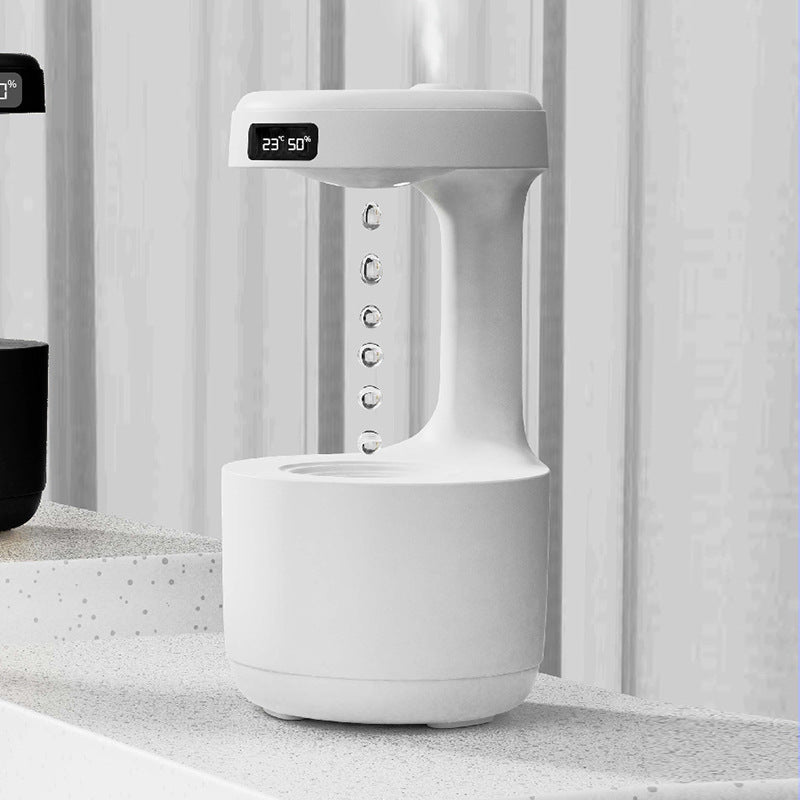 White anti-gravity humidifier with clock display and side control buttons