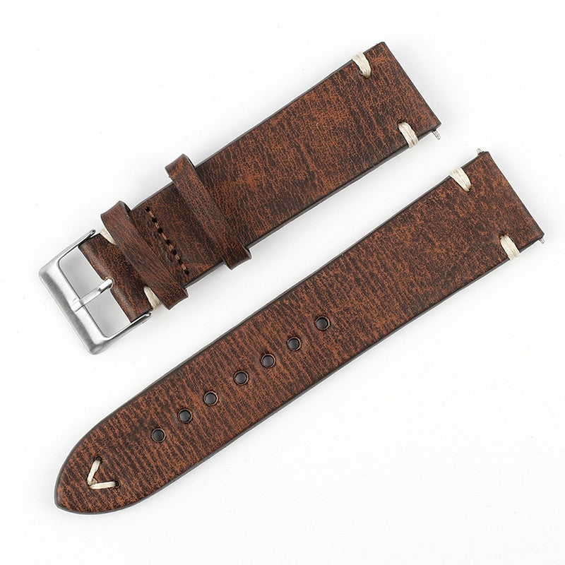 Deep brown patterned leather watch strap with silver buckle and perforated adjustment holes
