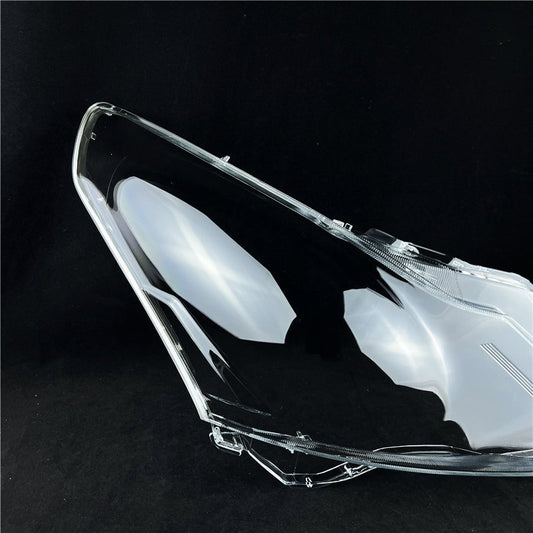 Clear car headlight cover on a black background