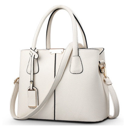 White leather shoulder tote bag with gold-tone hardware and adjustable crossbody strap