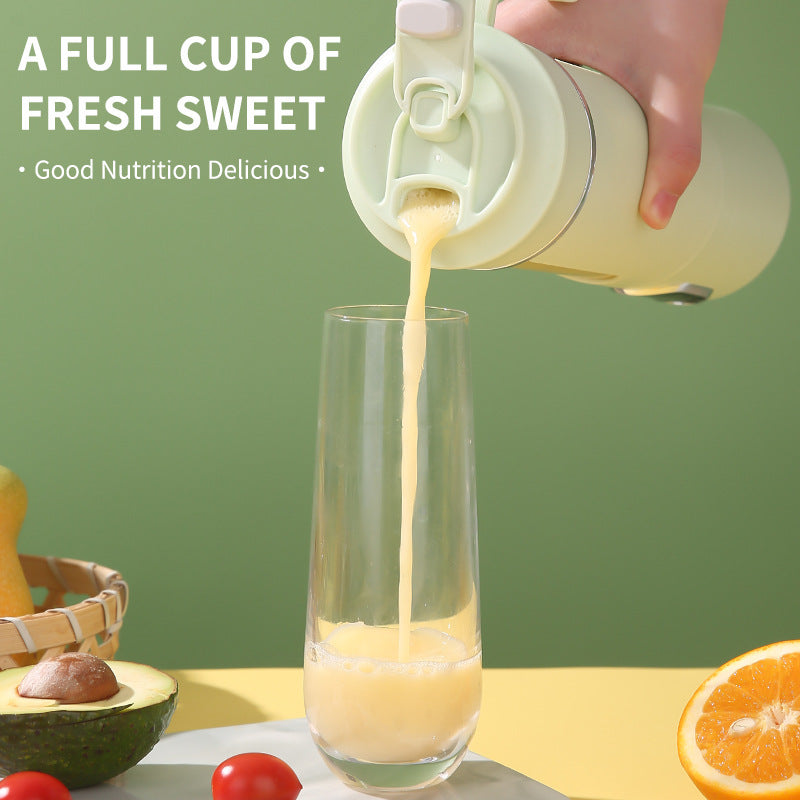 Portable rechargeable juice blender pouring pale yellow juice into a drinking glass.