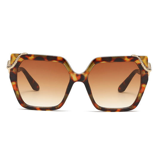 Sunglasses with tortoiseshell frame and brown lenses on a white background