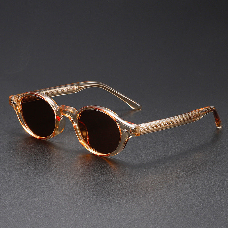 Men’s small round sunglasses with translucent orange-brown frame and dark brown lenses