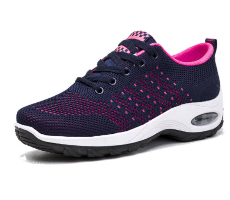 Navy knit walking sneakers with pink accents, check tongue patch, and white sole