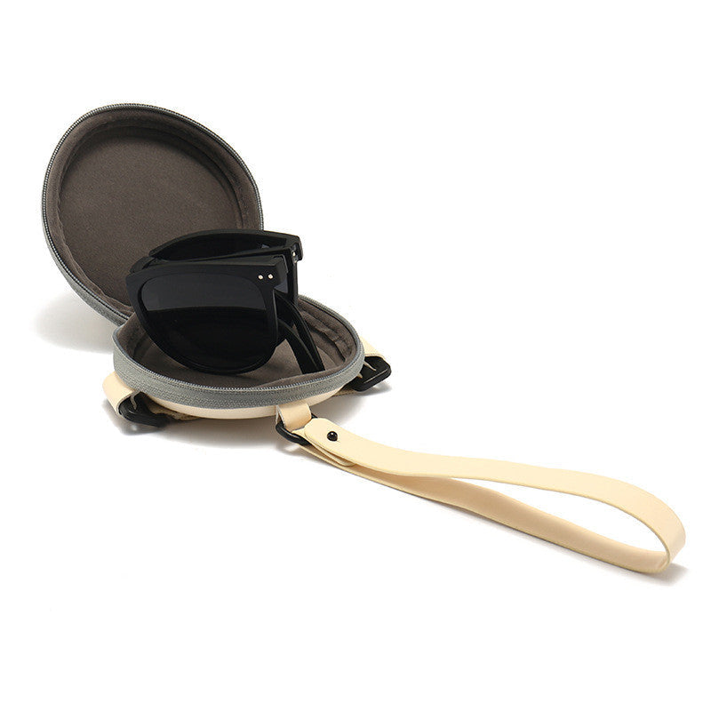 Polarized folding sunglasses for women with black lens and case