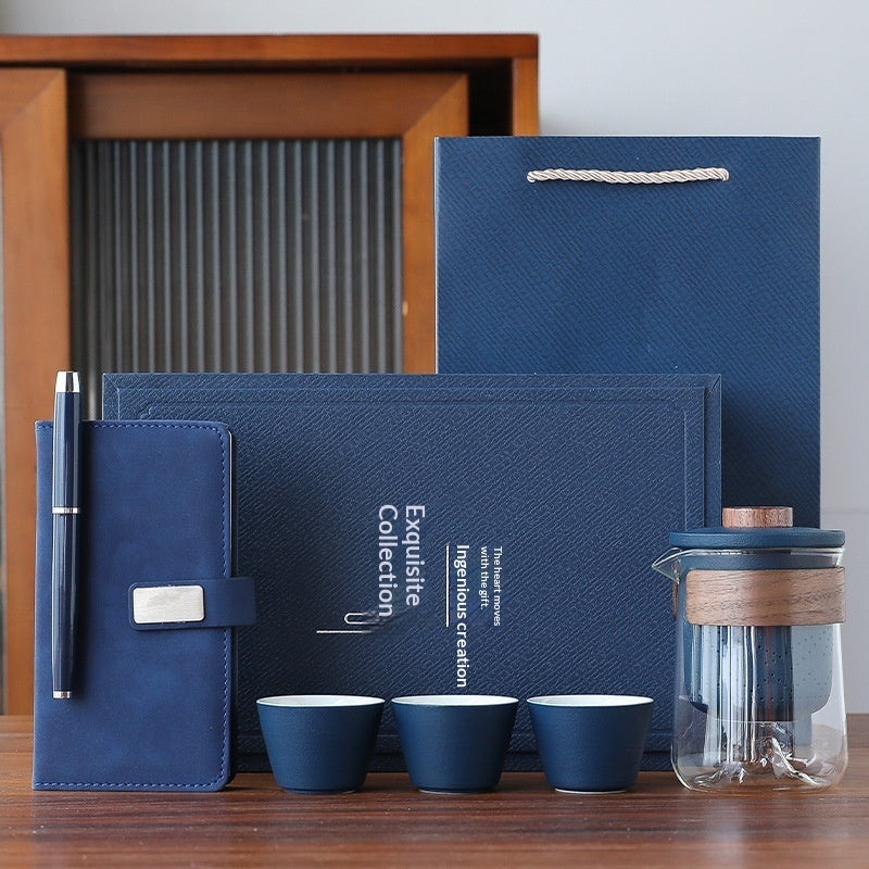Blue office gift set with notebook, pen, dark blue tea cups, and tea pot tumbler