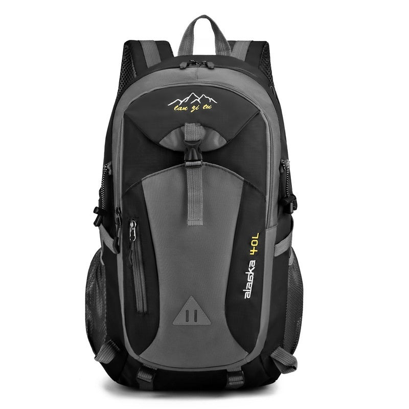 Outdoor polyester backpack in black and gray with front zip pocket and padded shoulder straps.