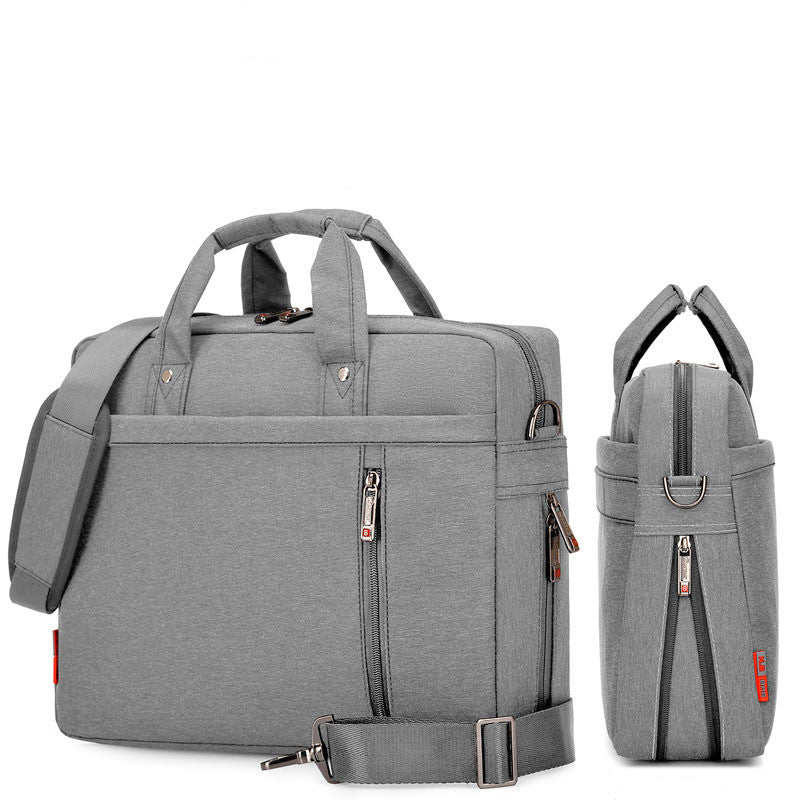 Grey waterproof oxford laptop bag with front zip pocket, side handle, and crossbody strap