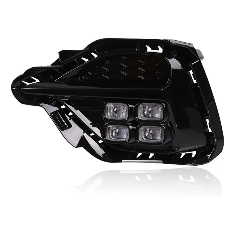 Single black fog lamp housing with four-lens LED module and mounting brackets