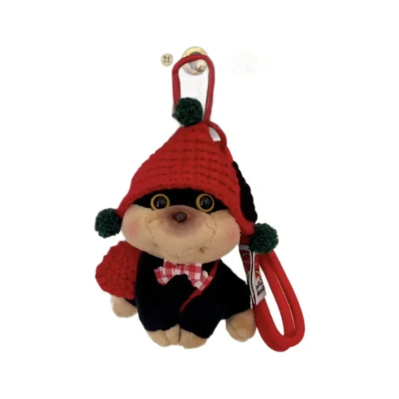 Plush puppy keychain with red knit hat, green pom-poms, and red leash strap.