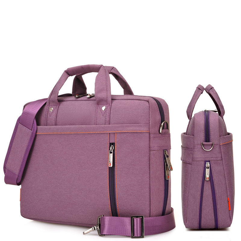Purple waterproof laptop bag with front zipper divider, top handles, and adjustable strap